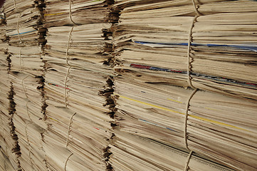 Image showing Piles of recycled newspapers on an angle