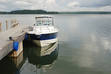 Image showing big white boat tied up at the seashore