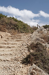 Image showing path through mountains ,stone step close up