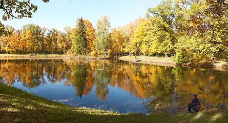 Image showing Teen Enjoys the Fall Alone near water