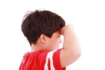 Image showing boy intently looking far away, isolated on white background 