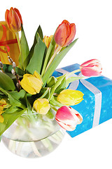 Image showing Tulips and boxes with gifts, it is isolated on white