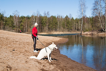 Image showing  sports woman with a dog