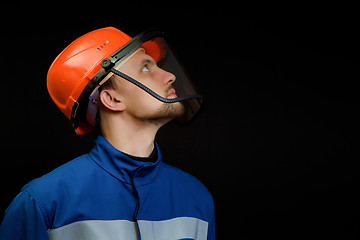 Image showing worker in overalls and a helmet