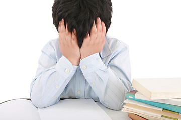 Image showing Schoolboy being stressed by his homework, isolated on white back