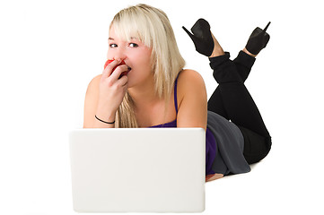 Image showing Young girl eating an apple