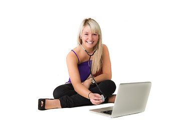 Image showing Young girl checking here laptop
