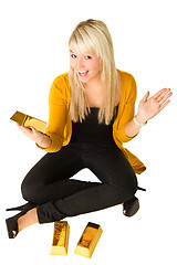 Image showing Young happy girl with goldbars