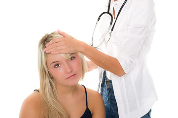 Image showing Young girl examined by doctor
