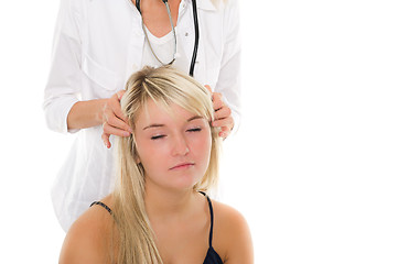 Image showing Young girl examined by doctor