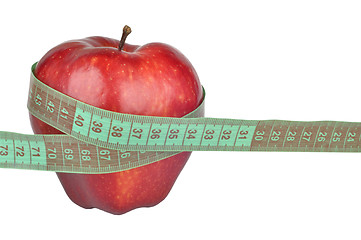 Image showing Red apple measured the meter