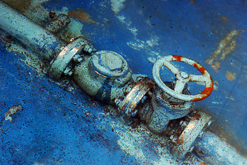 Image showing Rusty blue pipes