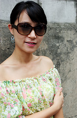 Image showing Asian woman wearing big shades