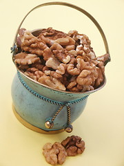 Image showing Metal vase with walnuts