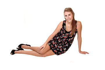 Image showing Girl sitting on floor.