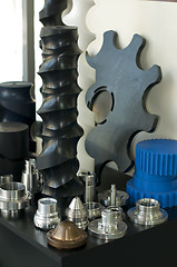 Image showing Plastic and metal machine parts. Vertical imagel
