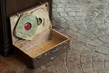 Image showing Old Antique suitcase with gramophone discs