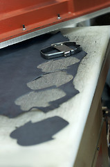 Image showing Cutting leather for shoes