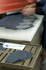 Image showing Cutting leather for shoes