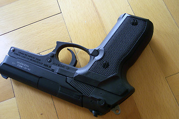 Image showing a gun on the floor