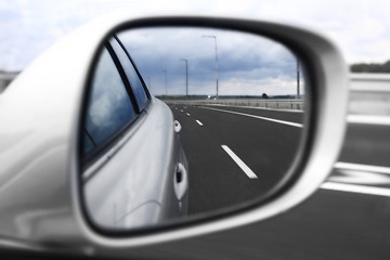 Image showing Landscape in the mirror of a car