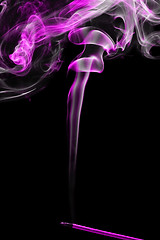 Image showing incense stick with smoke over black