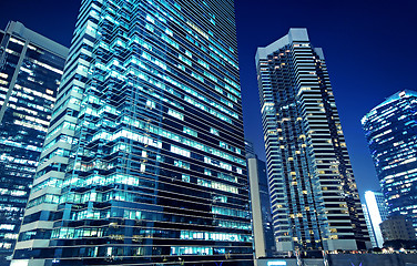 Image showing Tall office buildings by night 