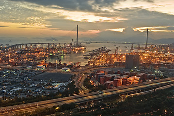 Image showing Port warehouse with cargoes and containers at night 