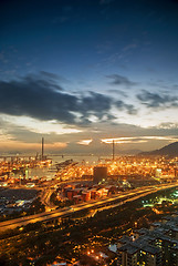 Image showing Port warehouse with cargoes and containers at night 