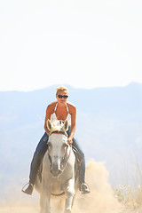 Image showing Young rider on the beach