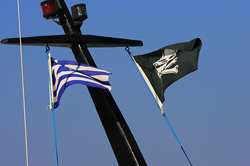 Image showing Pirate flag flying from a ship's mast.