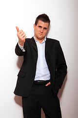 Image showing Cool businessman standing 