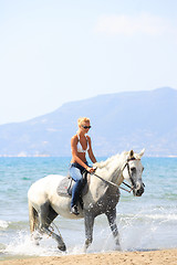 Image showing Young rider on the beach