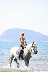 Image showing Young rider on the beach