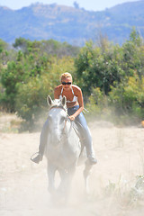 Image showing Young rider on the beach