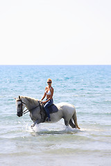 Image showing Young rider on the beach