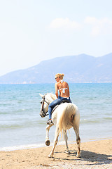 Image showing Young rider on the beach