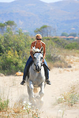 Image showing Young rider on the beach