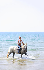 Image showing Young rider on the beach