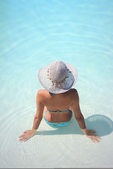 Image showing Beautiful young woman at a pool