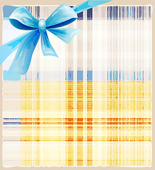 Image showing checked  background with blue silk bow 