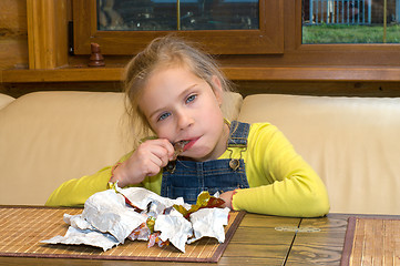 Image showing Girl with chocolates.