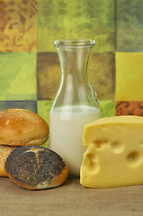 Image showing milk bottle , cheese and fresh rolls