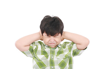 Image showing Little boy closing his eyes and ears with his hands, isolated on