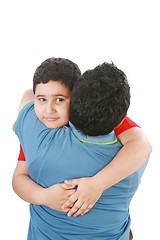 Image showing Portrait of a young boy hugging his father against white backgro