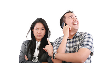 Image showing Impatient woman standing with arms crossed looking at his boyfri