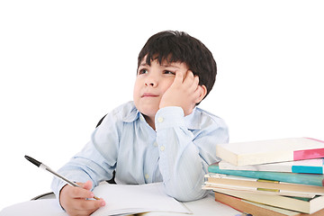 Image showing Upset schoolboy doing homework isolated on white 