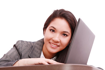 Image showing Young business woman on a laptop - isolated on white 