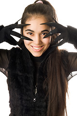 Image showing Portrait of smiling young woman in gloves