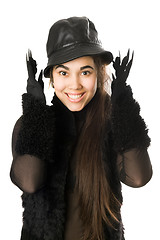 Image showing Portrait of cheerful girl in gloves with claws. Isolated